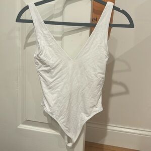 super cute white bodysuit from aritzia, worn once, size xs